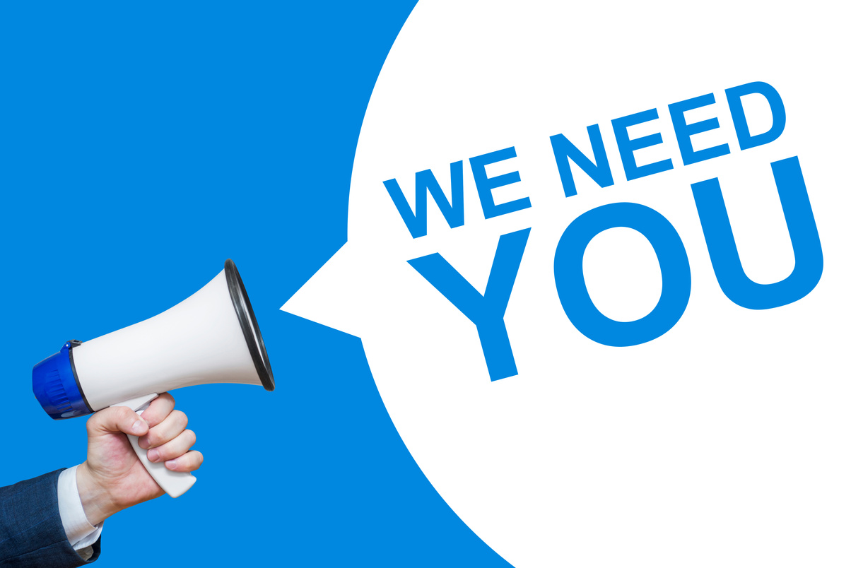 Male hand holding a megaphone with WE NEED YOU bubble. Speaker. Banner for business, marketing and advertising.