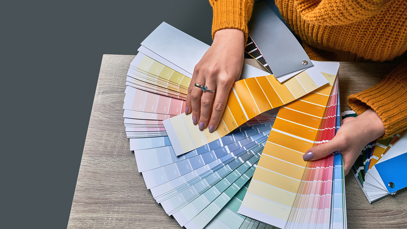 Woman Designer Choosing from  Color Pallettes 