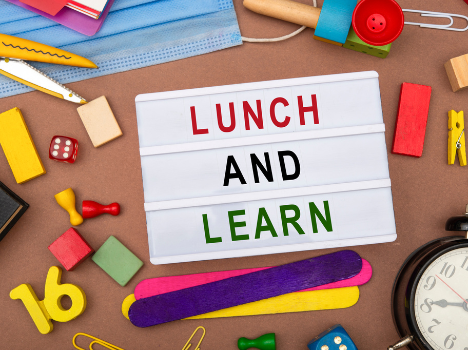 Lunch and learn sign with office stationery